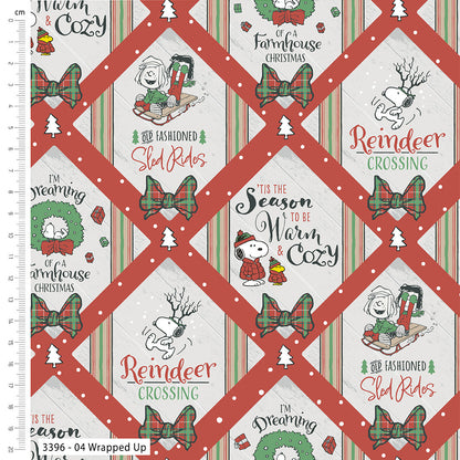 Christmas-themed fabric with Snoopy and Woodstock designs, featuring text and patterns on a grid.