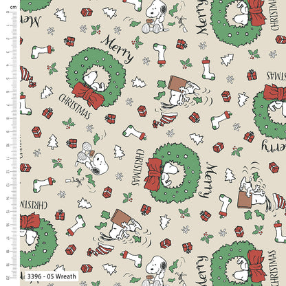 Christmas-themed fabric with Snoopy and Woodstock designs on a beige background.