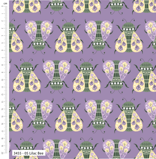 Pattern of stylized bees on a purple background with a ruler for scale.
