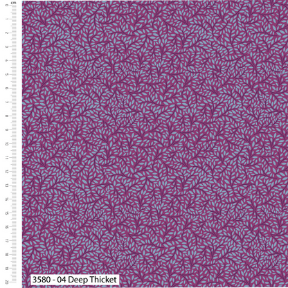 Purple fabric with a subtle pattern and a ruler for scale on the side.