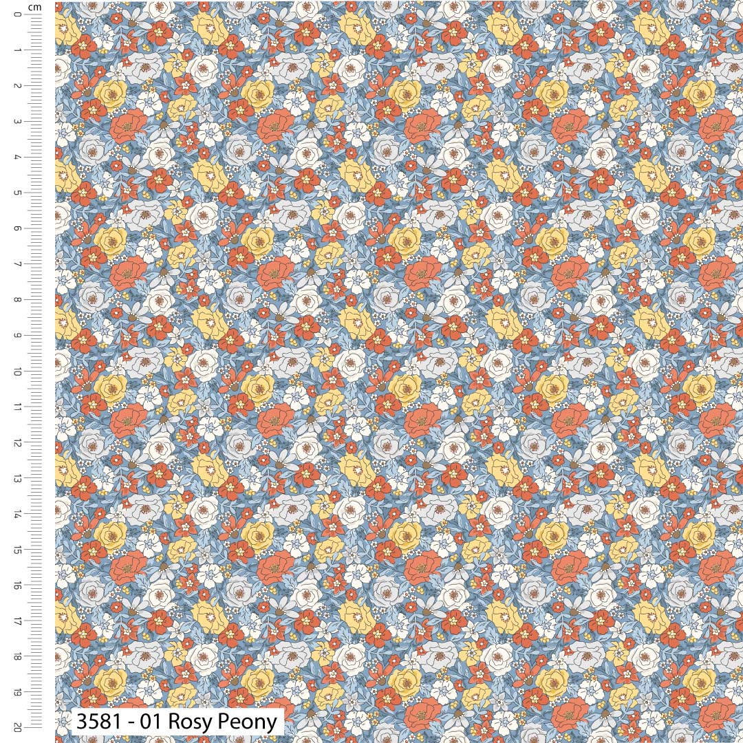 Floral pattern with red, yellow, and white flowers on a blue background, with a ruler for scale.