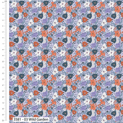 Floral pattern with orange, purple, and white flowers on a blue background, with a ruler for scale.