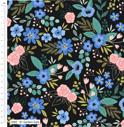 Floral pattern with blue, pink, and green flowers on a black background, with a ruler for scale.