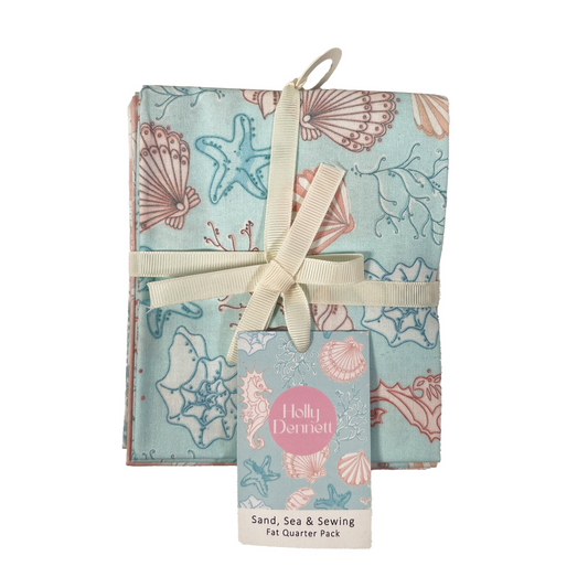 Fabric pack with shell pattern and ribbon, featuring Holly Donnelly branding.