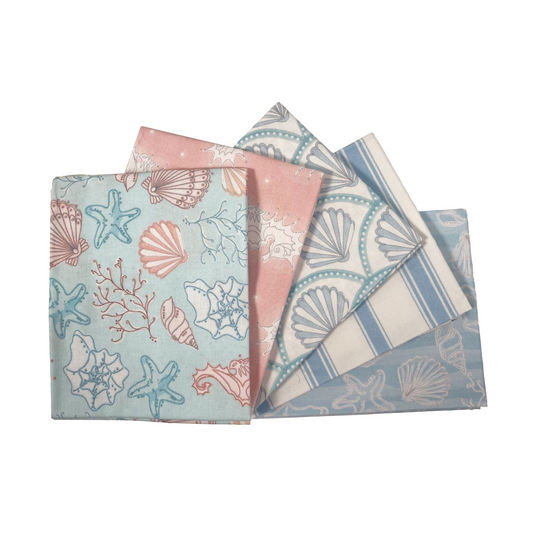Set of four fabric swatches with beach-themed patterns on a white background