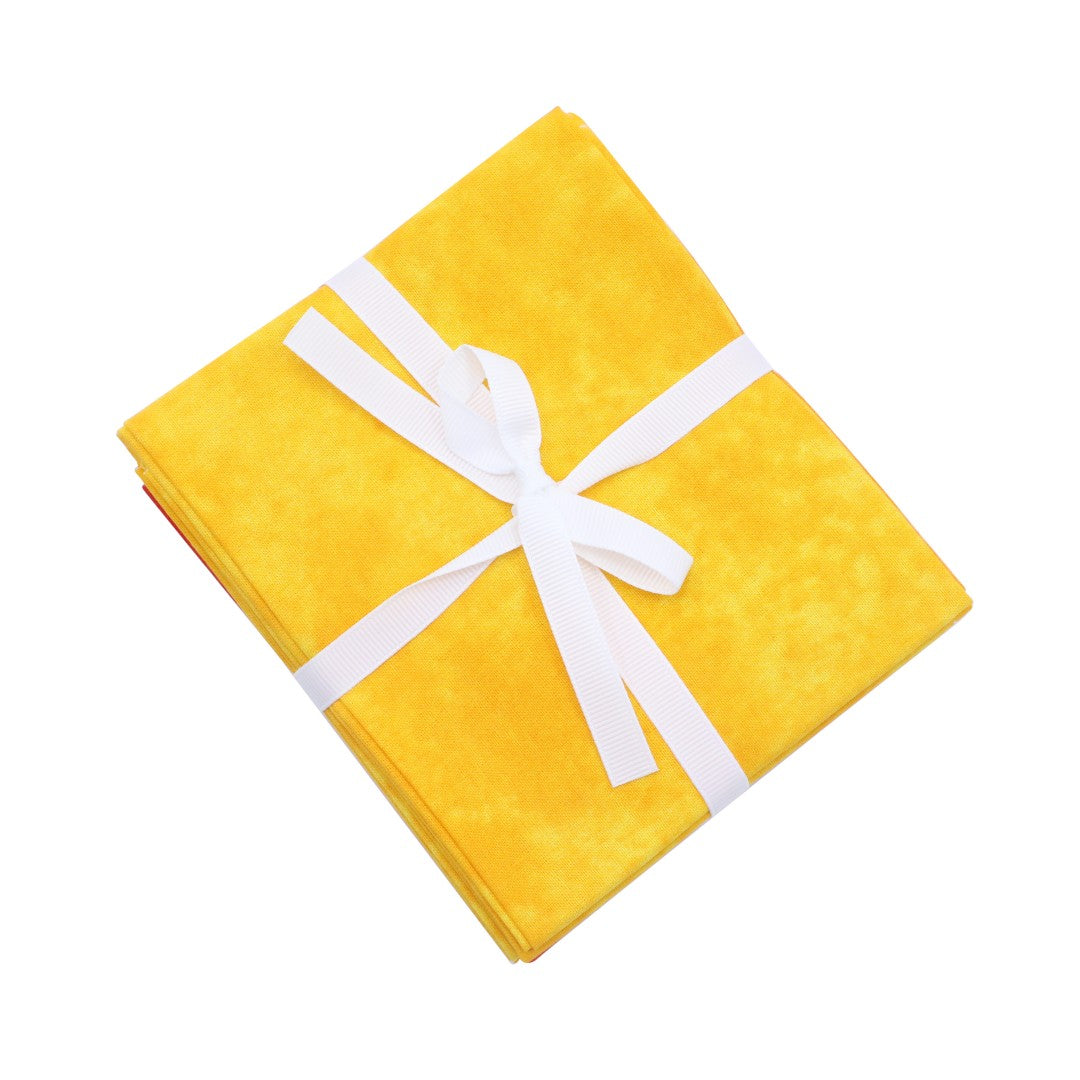Yellow gift box with a white ribbon on a white background