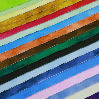 Stack of colorful fabric swatches arranged in a grid.