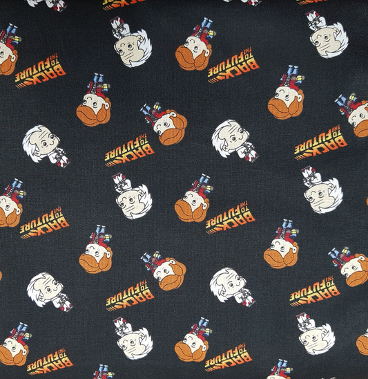 Patterned fabric with cartoon characters and text on a black background