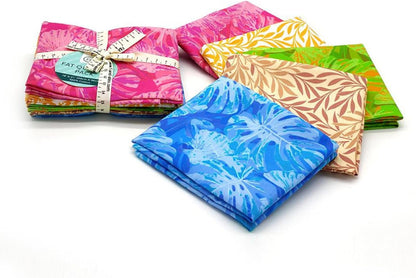 Collection of colorful fabric fat quarters on a white background