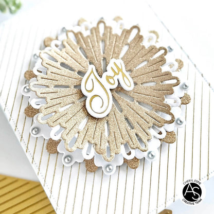 Decorative card with gold and white design featuring the word 'joy'.
