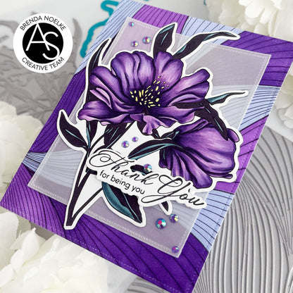 Purple floral card with 'Thank you for being you' text on a textured surface