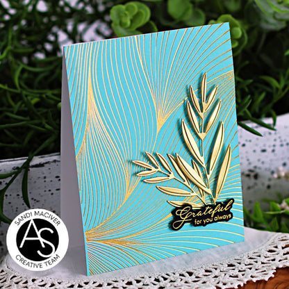 Decorative card with gold leaf design and 'Grateful for you always' text on a teal background, with a brand logo in the corner.