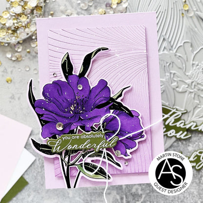 Card with purple floral design and 'you are absolutely wonderful' text on a textured surface.