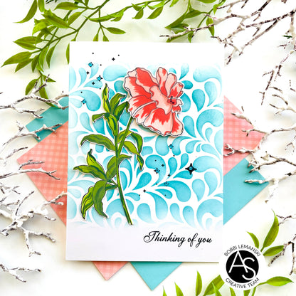 Card with floral design and 'Thinking of you' text on a decorative background