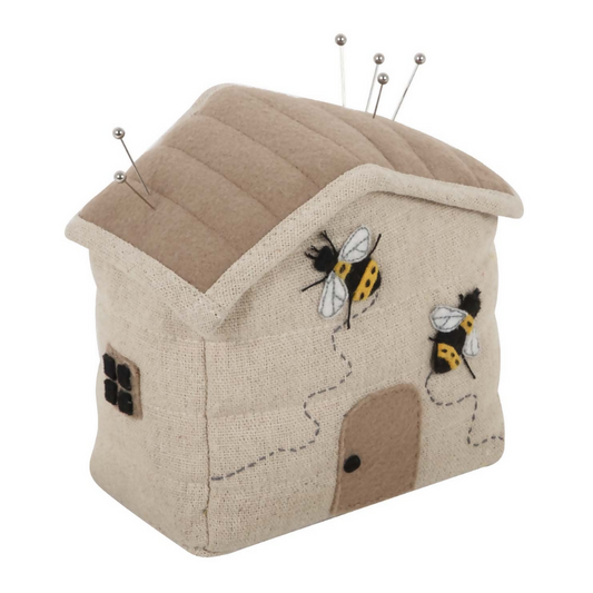 Bee House Pincushion, showing beehive shape and embroidered bee house design