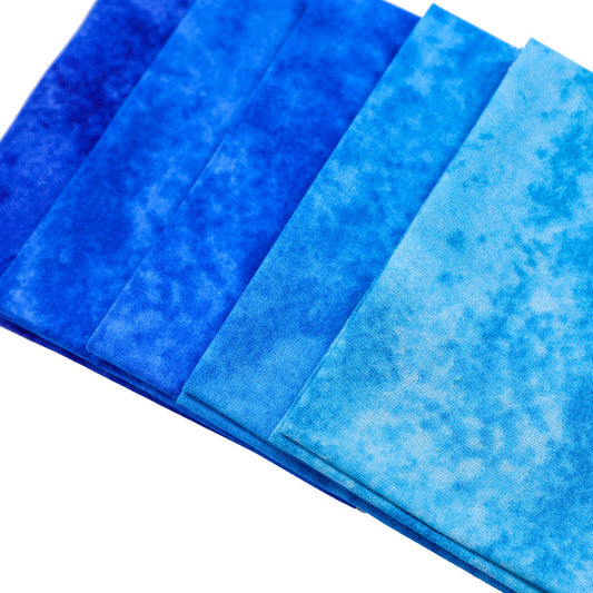 Set of blue fabric swatches with a textured pattern on a white background
