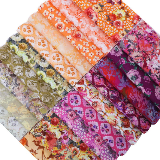 Stack of floral fabric swatches in various colors and patterns.