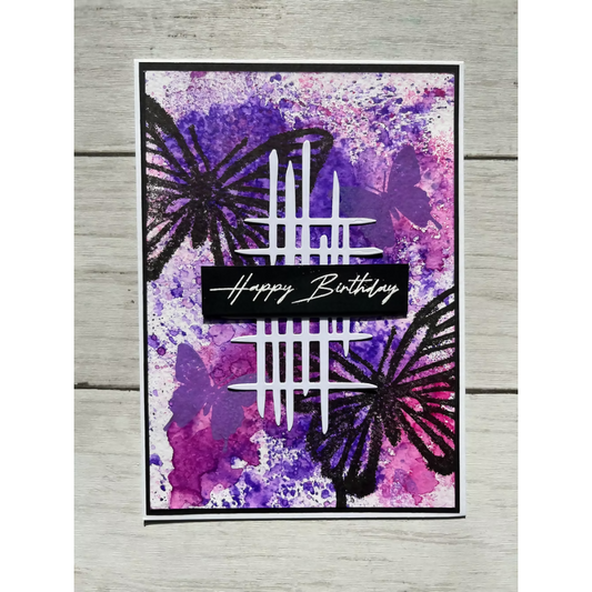 Greeting card with butterflies and 'Happy Birthday' text on a purple and pink watercolor background.