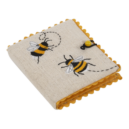 Embroidered Bee Needlecase, closed, showing embroidered bee design on fabric