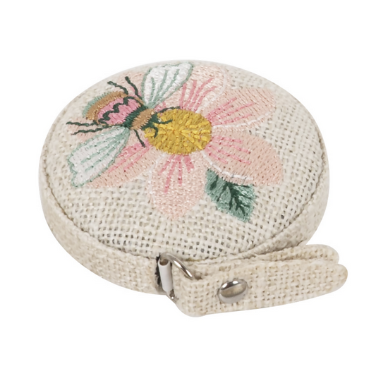 Embroidered Patchwork Bee Tape Measure, closed, showing floral bee design on polyester casing