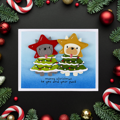 Christmas card with two dog-themed trees and festive decorations on a black background