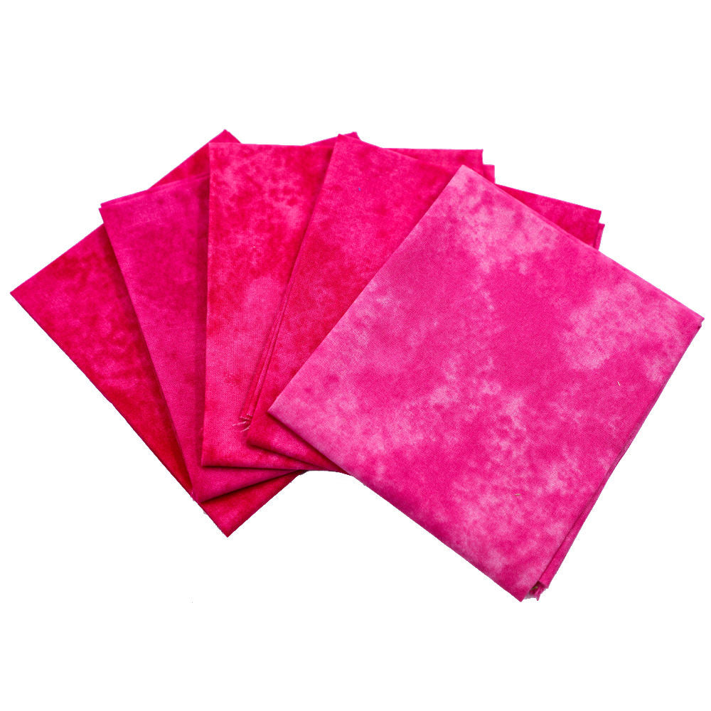 Set of pink fabric squares on a white background