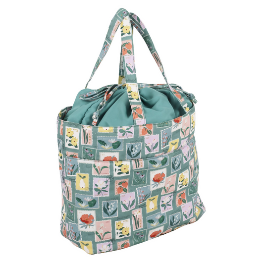 Large Embroidered Stamps Drawstring Craft Bag, closed, showing stamp print and drawstring