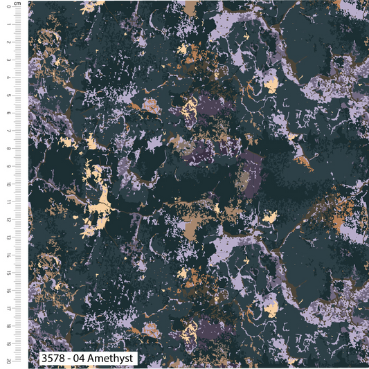 Textured fabric with gold and purple speckles on a dark background, with a ruler for scale.