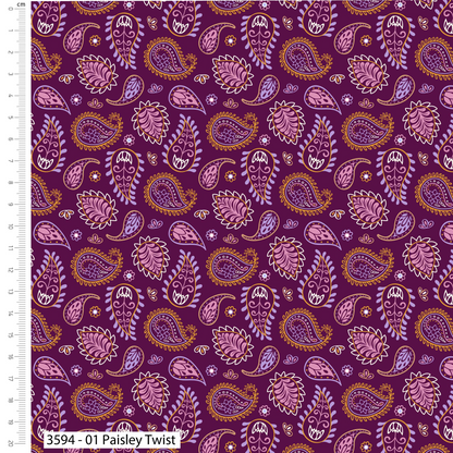 Patterned fabric with paisley design on a purple background, accompanied by a ruler for scale.