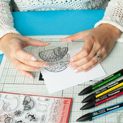 Della by Design Christmas being stamped