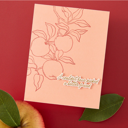 Card with apple illustration and text on a red background