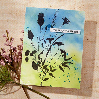 Greeting card with floral design and 'You brighten my day' text on a textured surface.