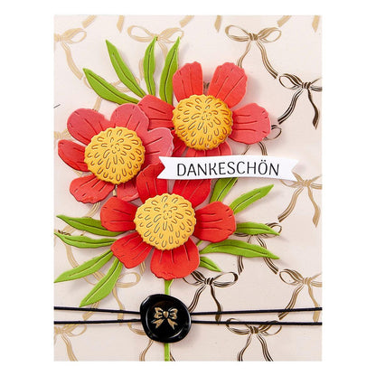 Greeting card with red flowers, green leaves, and 'DANKESCHÖN' text on a decorative background.