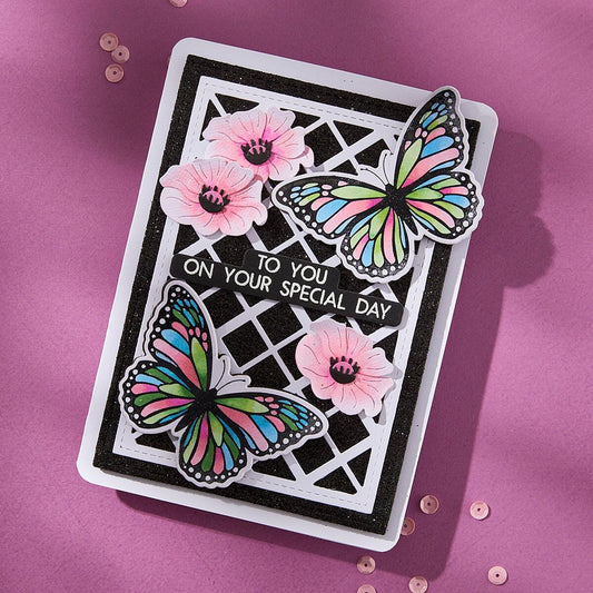 Greeting card with butterflies and flowers on a pink background