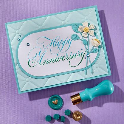 Handmade 'Happy Anniversary' card with floral design on a purple background