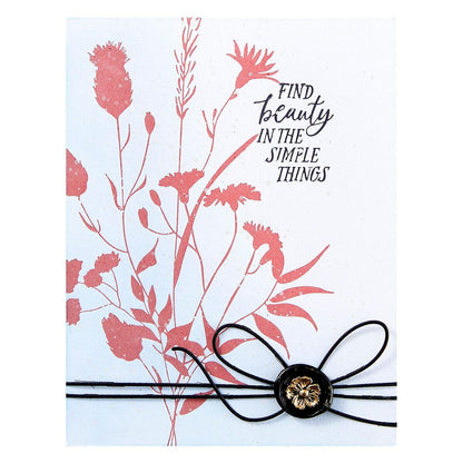 Bracelet with floral design and 'Find beauty in the simple things' text on a white background