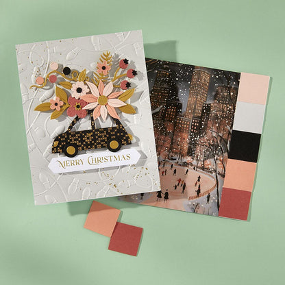 Two Christmas cards on a green background, one with floral design and 'Merry Christmas' text, the other with a cityscape illustration.