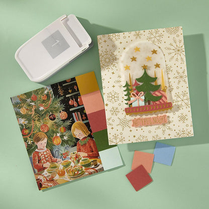 Set of Christmas-themed cards and a card-making kit on a green background