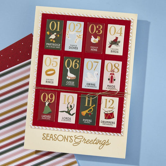 A finished handmade holiday card with a creative design from the kit.