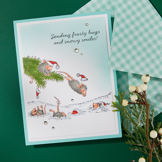A finished Christmas card featuring a stamped design from the Spellbinders Snowy Smiles stamp set.