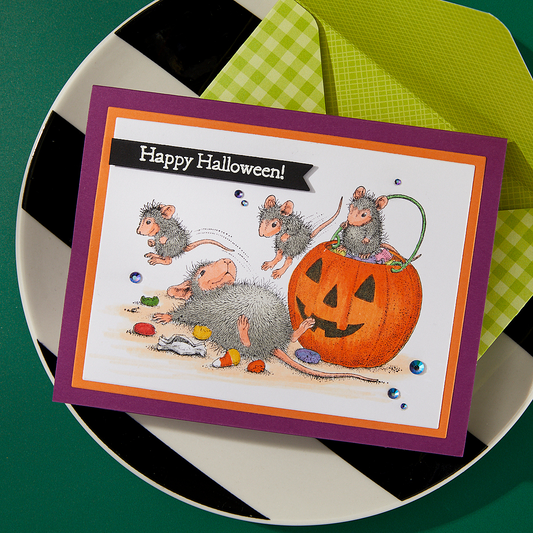 A finished Halloween card featuring a stamped design from the Spellbinders Trick or Treat stamp set.