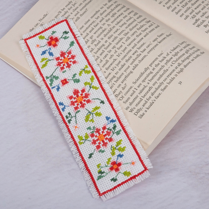 Trimits Floral Cross Stitch Bookmark Kit on a book