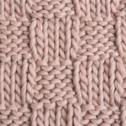 Close-up of a pink knitted fabric pattern