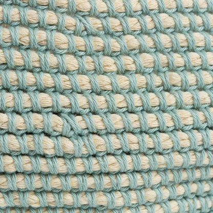 Close-up of a textured fabric with alternating light blue and beige threads.