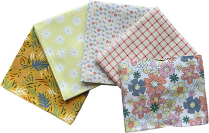 Five fabric swatches with different patterns on a white background