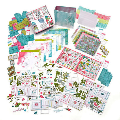 Collection of stationery items including cards, envelopes, and decorative paper on a white background