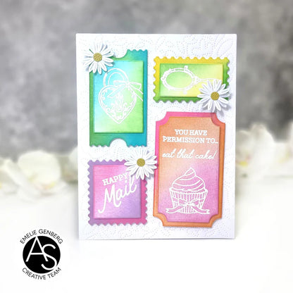Colorful card with decorative stamps featuring text and flowers on a gray background.