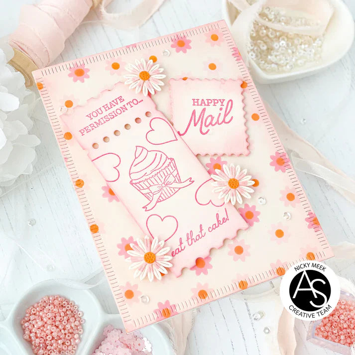 Decorative card with floral designs and text on a white surface with decorative items.