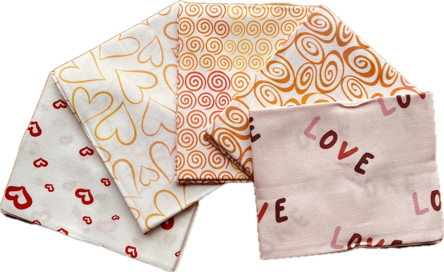 Set of four patterned fabric swatches with different designs on a white background