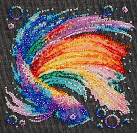 Colorful beaded design of a rainbow on a black background